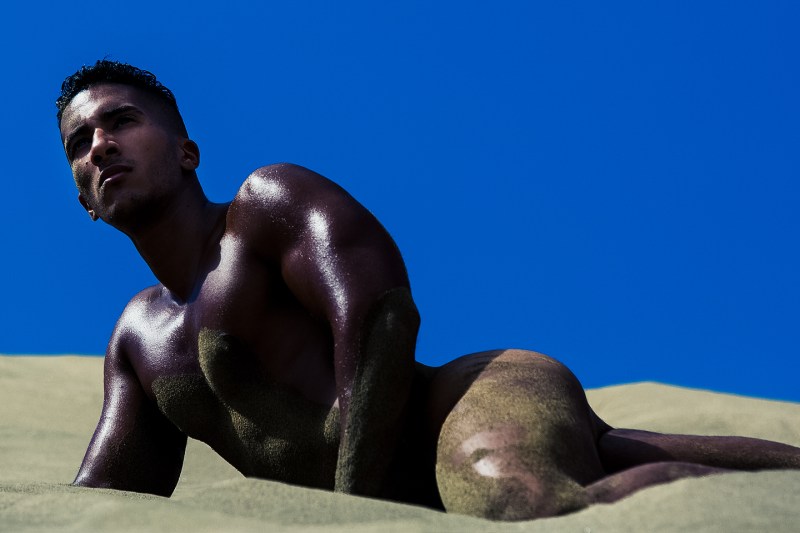 Shooting at Maspalomas Dunes, Spain. Photographer Adrián C. Martín and model Karim Gasmi posing with famous American label Charlie by Matthew Zink.